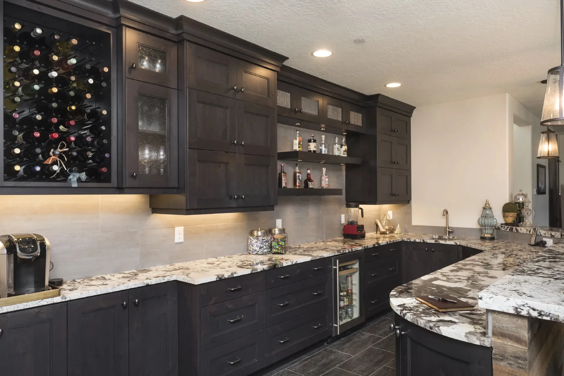 Custom bar and kitchenette by Millcreek Cabinet and Design
