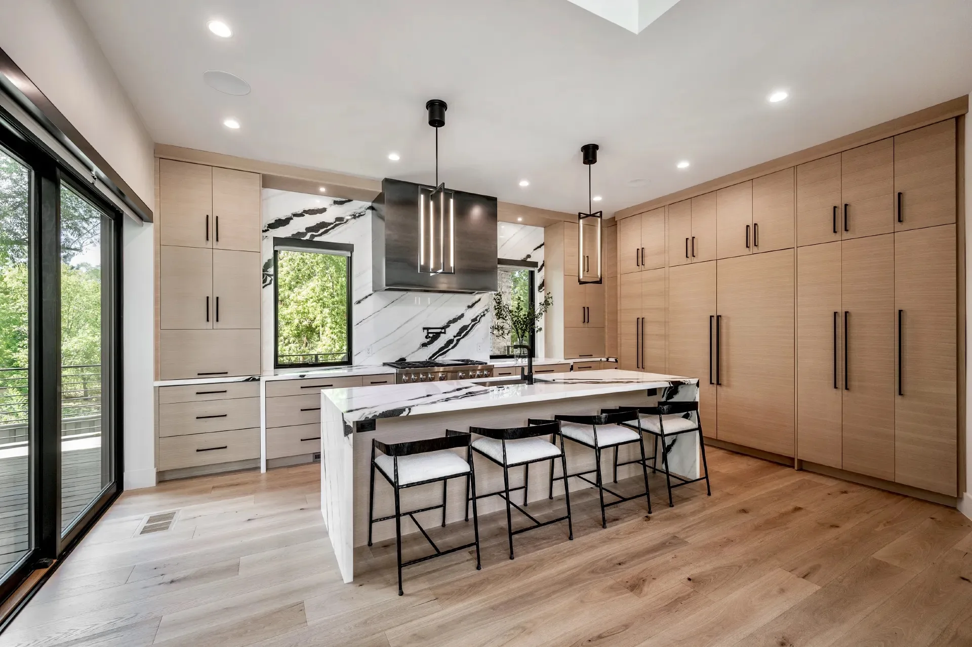 Custom frameless white oak kitchen by Millcreek Cabinet and Design