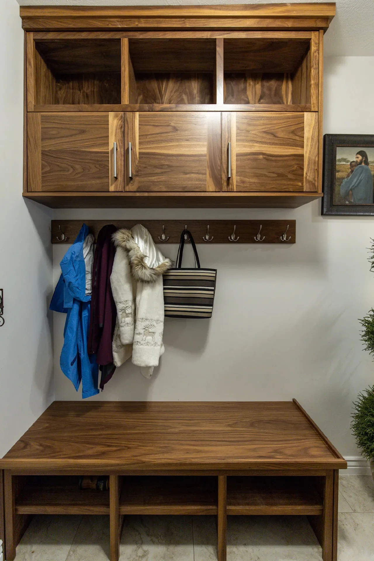Custom walnut mud room cabinetry by Millcreek Cabinet and Design